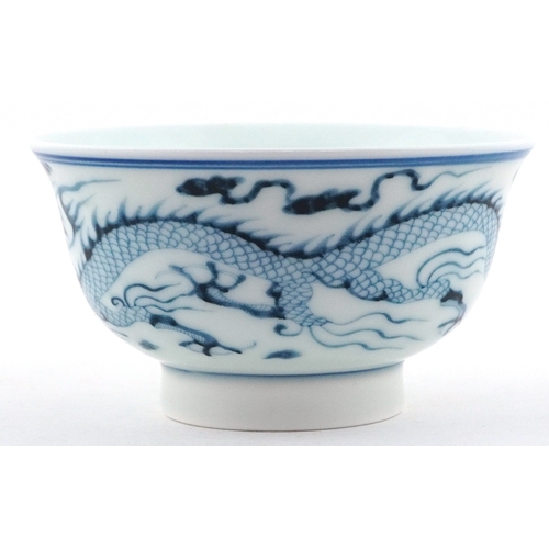 57 - Chinese blue and white porcelain rice bowl, the interior hand painted with dragon within two blue co... 