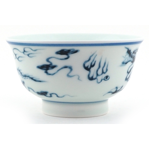 57 - Chinese blue and white porcelain rice bowl, the interior hand painted with dragon within two blue co... 