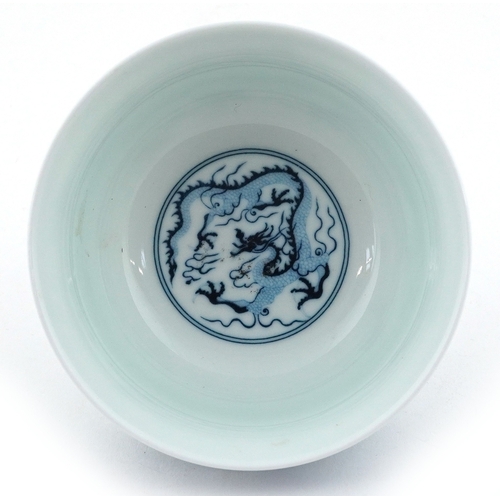 57 - Chinese blue and white porcelain rice bowl, the interior hand painted with dragon within two blue co... 