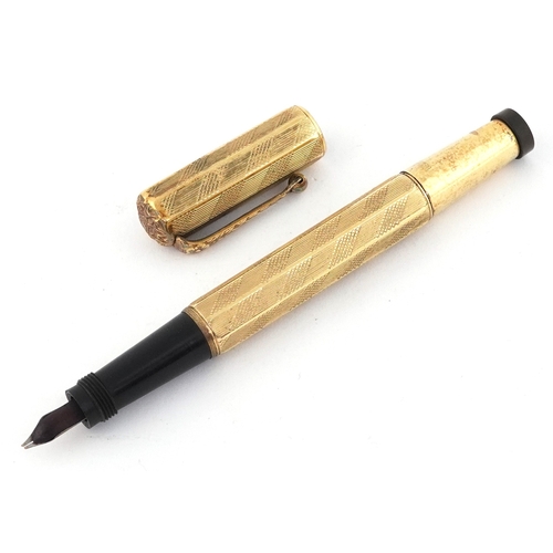 48 - Europa gold plated engine turned fountain pen with 14K gold nib, housed in a Magic Fountain pen box.