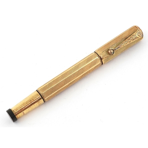 48 - Europa gold plated engine turned fountain pen with 14K gold nib, housed in a Magic Fountain pen box.
