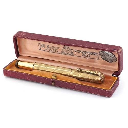 48 - Europa gold plated engine turned fountain pen with 14K gold nib, housed in a Magic Fountain pen box.