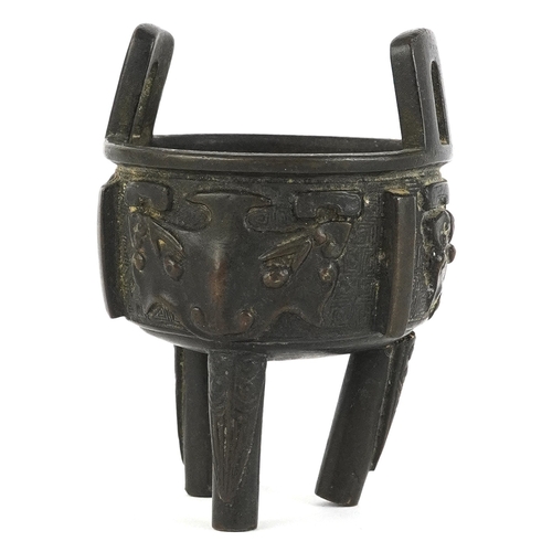 299 - Chinese bronze tripod censer decorated with bats, 8cm high.