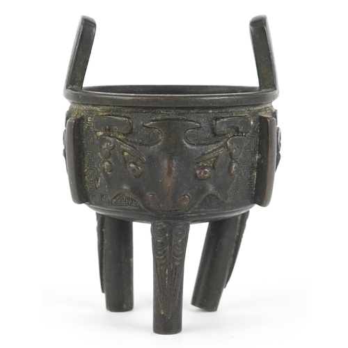 299 - Chinese bronze tripod censer decorated with bats, 8cm high.