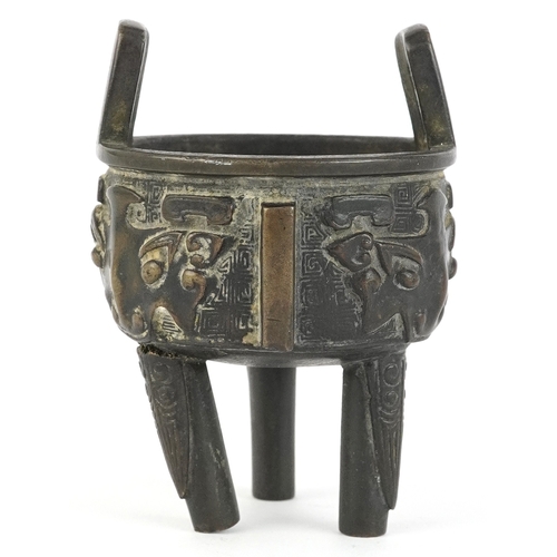 299 - Chinese bronze tripod censer decorated with bats, 8cm high.