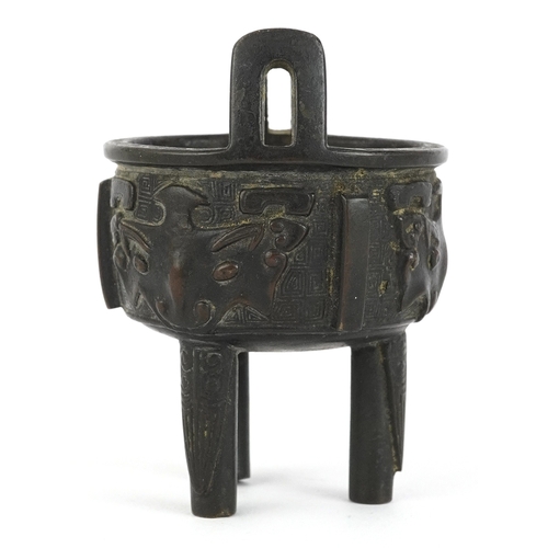 299 - Chinese bronze tripod censer decorated with bats, 8cm high.