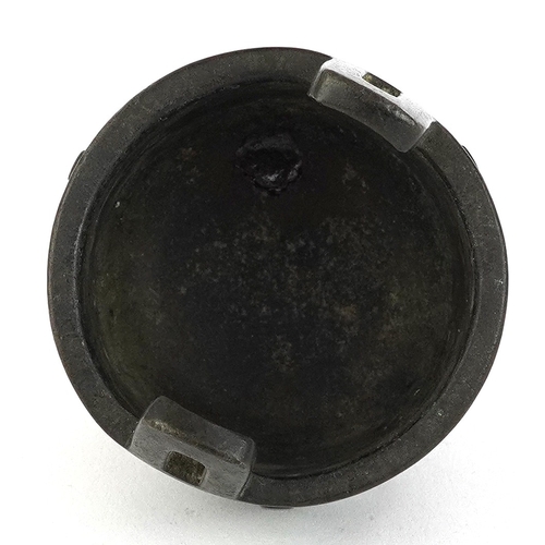299 - Chinese bronze tripod censer decorated with bats, 8cm high.
