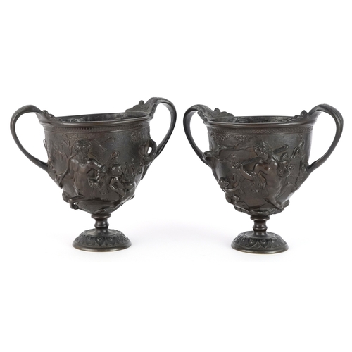 37 - Pair of 19th century Grand Tour bronze twin handled urns profusely decorated in repoussé after the K... 