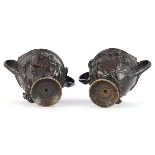 37 - Pair of 19th century Grand Tour bronze twin handled urns profusely decorated in repoussé after the K... 