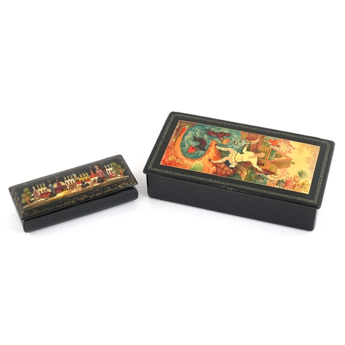 372 - Two Russian lacquered papier mâché boxes hand painted with traditional folk art, the largest 16cm wi... 