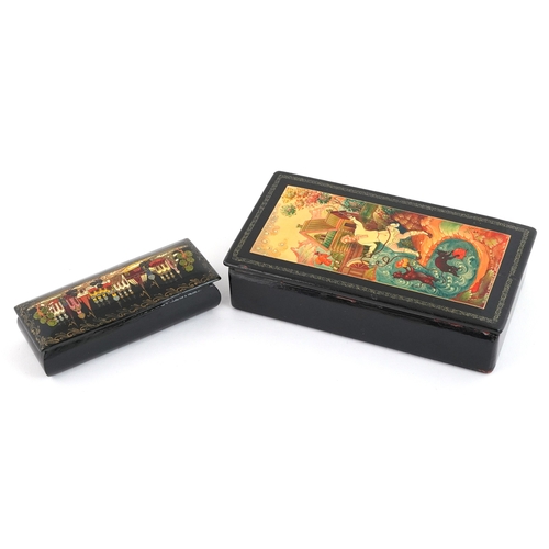 372 - Two Russian lacquered papier mâché boxes hand painted with traditional folk art, the largest 16cm wi... 