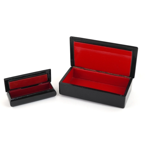 372 - Two Russian lacquered papier mâché boxes hand painted with traditional folk art, the largest 16cm wi... 