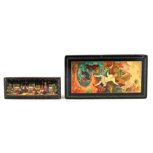 372 - Two Russian lacquered papier mâché boxes hand painted with traditional folk art, the largest 16cm wi... 