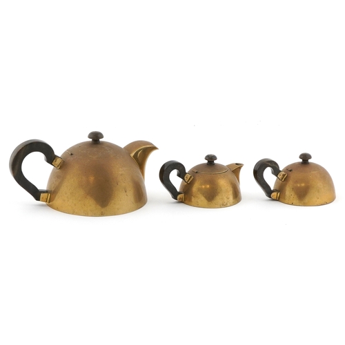 34 - Modernist three piece brass tea set with horn handles, the largest 25cm wide.