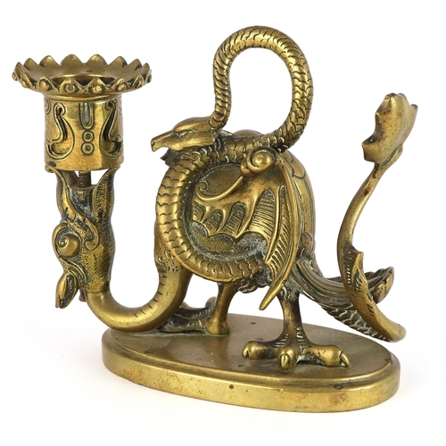 Gilt bronze candlestick in the form of a mythical creature, 13cm wide.