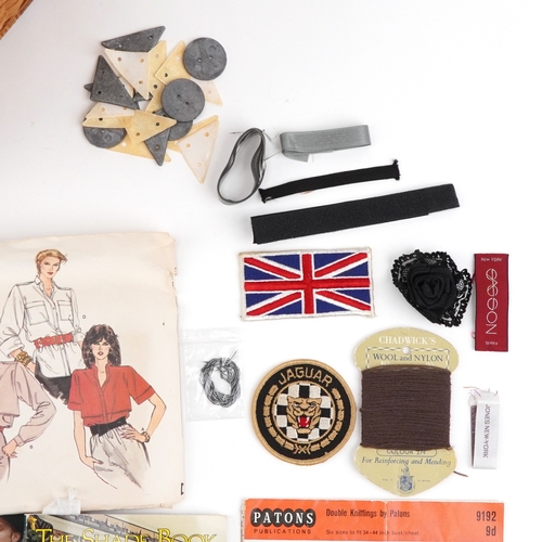 1262 - Vintage sewing items including buttons, patterns and designs by Vogue, McCalls, Butterick and fabric... 