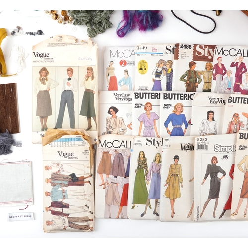 1262 - Vintage sewing items including buttons, patterns and designs by Vogue, McCalls, Butterick and fabric... 