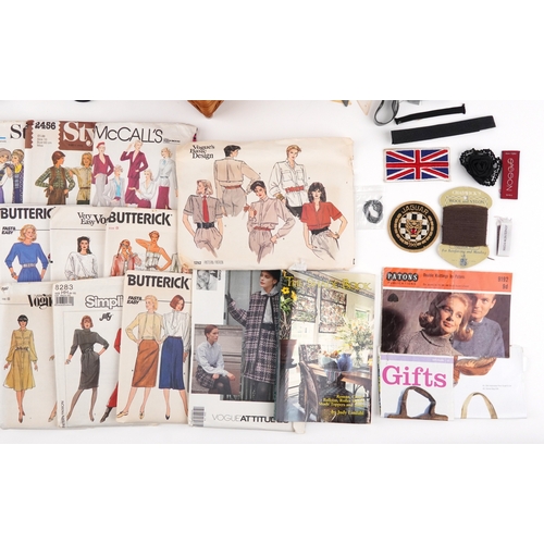 1262 - Vintage sewing items including buttons, patterns and designs by Vogue, McCalls, Butterick and fabric... 
