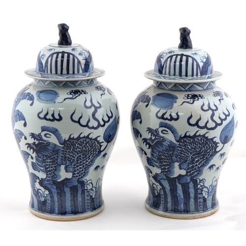278 - Large pair of Chinese blue and white porcelain baluster vases with covers, decorated with dragons, e... 