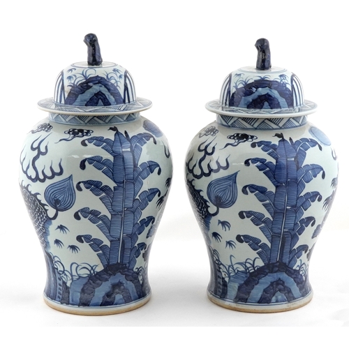 278 - Large pair of Chinese blue and white porcelain baluster vases with covers, decorated with dragons, e... 