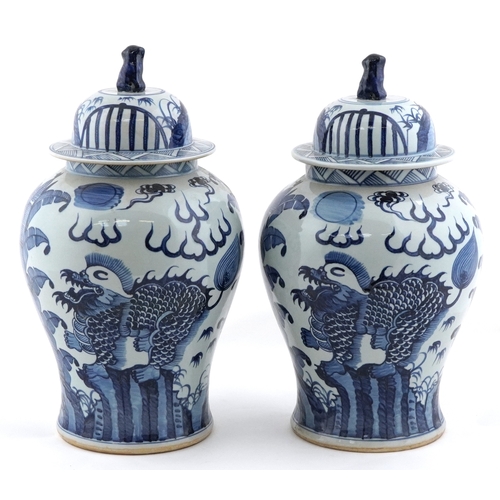 278 - Large pair of Chinese blue and white porcelain baluster vases with covers, decorated with dragons, e... 