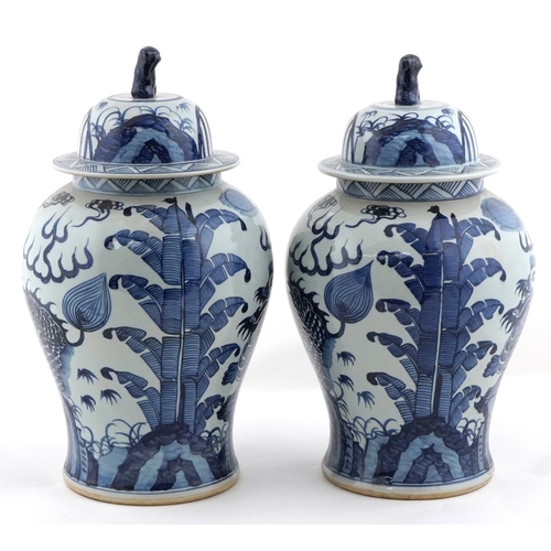 278 - Large pair of Chinese blue and white porcelain baluster vases with covers, decorated with dragons, e... 