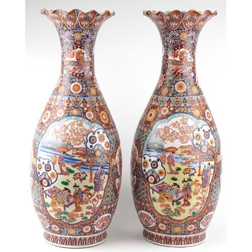 52 - Pair of very large floor standing Japanese Imari vases decorated with panels of figures in landscape... 