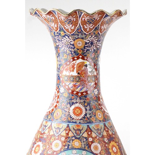 52 - Pair of very large floor standing Japanese Imari vases decorated with panels of figures in landscape... 