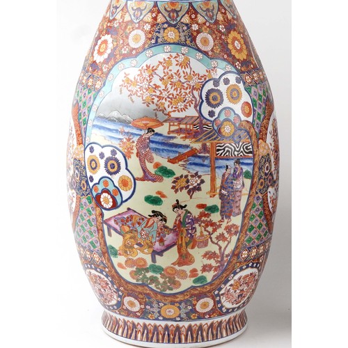 52 - Pair of very large floor standing Japanese Imari vases decorated with panels of figures in landscape... 