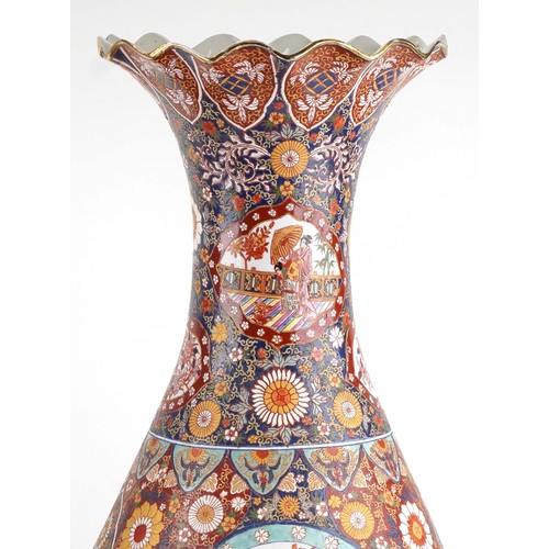 52 - Pair of very large floor standing Japanese Imari vases decorated with panels of figures in landscape... 
