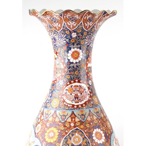 52 - Pair of very large floor standing Japanese Imari vases decorated with panels of figures in landscape... 