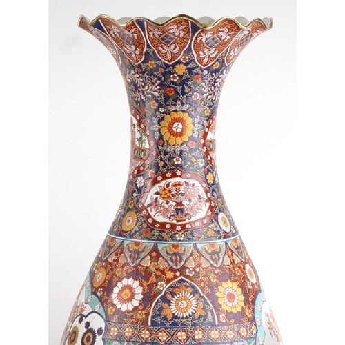 52 - Pair of very large floor standing Japanese Imari vases decorated with panels of figures in landscape... 