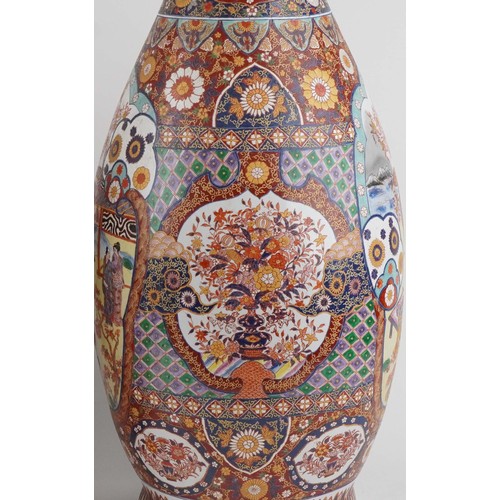52 - Pair of very large floor standing Japanese Imari vases decorated with panels of figures in landscape... 