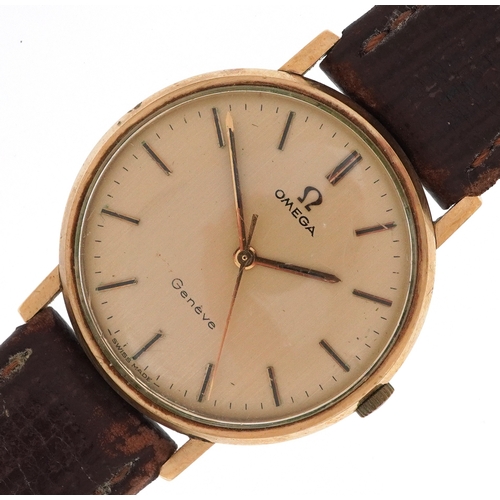 Omega, gentlemen's 9ct gold cased Omega Geneve manual wind wristwatch on a leather strap, the dial 30mm in diameter, housed in an Omega box total weight 30.2g.