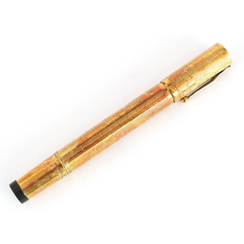 47 - Watermans Ideal 18ct gold cased fountain pen and inkwell set housed in a fitted case.