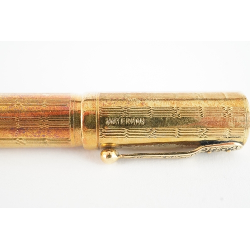 47 - Watermans Ideal 18ct gold cased fountain pen and inkwell set housed in a fitted case.