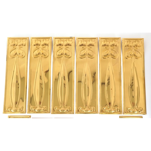 259 - Collection of Art Nouveau style copper and brass finger plates, 28cm high.