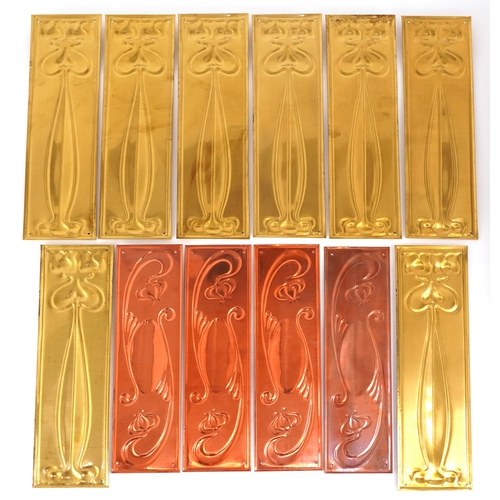 259 - Collection of Art Nouveau style copper and brass finger plates, 28cm high.