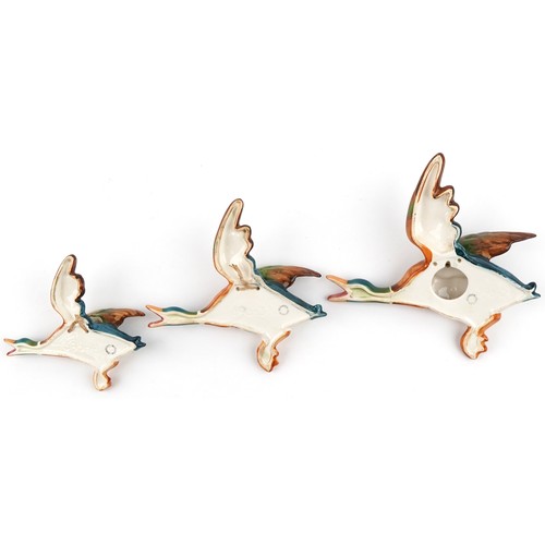  Three Beswick china wall hanging mallards, the largest 22cm wide.