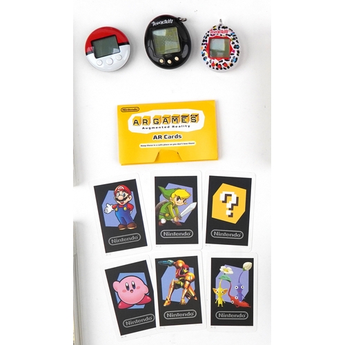 Vintage and later hand held games consoles with games and accessories ...