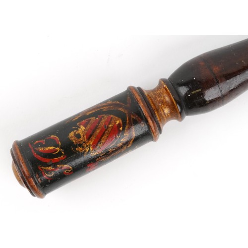  zzz S military interest truncheon hand painted with a crest, 28cm in length.