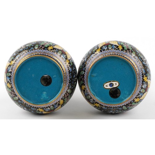  Pair of Chinese cloisonné brass vases enamelled with butterflies amongst flowers, 26cm high.