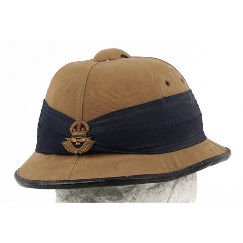  Military interest Wolseley style tropical pith helmet with RAF insignia.