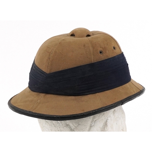  Military interest Wolseley style tropical pith helmet with RAF insignia.