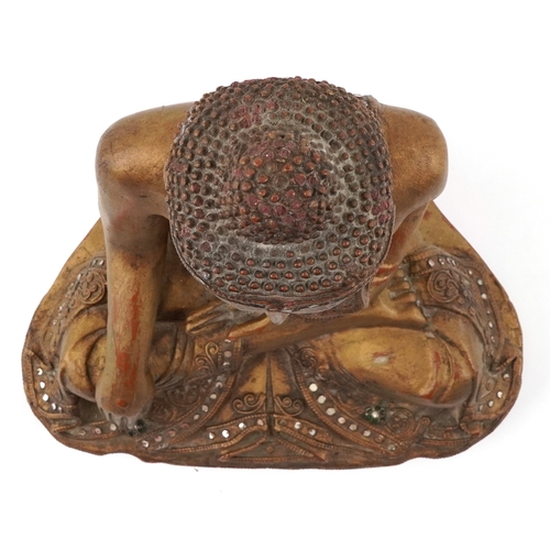  Burmese carved wood seated Buddha decorated with green and clear glass inlay, 34.5cm high.