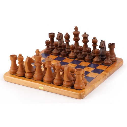 Vintage carved wood Staunton pattern chess set with a chess board, the largest piece 9.5cm high, the... 