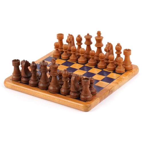  Vintage carved wood Staunton pattern chess set with a chess board, the largest piece 9.5cm high, the... 