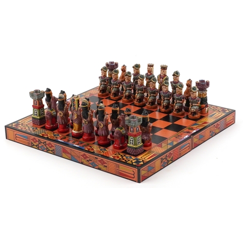 Vintage Mayan style hand painted chess set with folding chess board, the largest piece 9.5cm high, t... 
