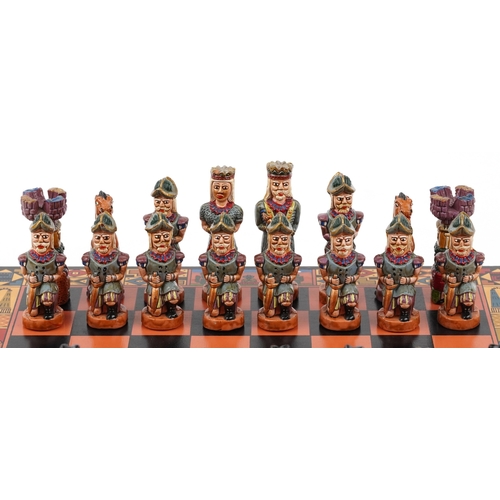  Vintage Mayan style hand painted chess set with folding chess board, the largest piece 9.5cm high, t... 