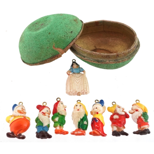  Set of 1930s film release Snow White & The Seven Dwarf painted plastic charms, the largest 3cm high.